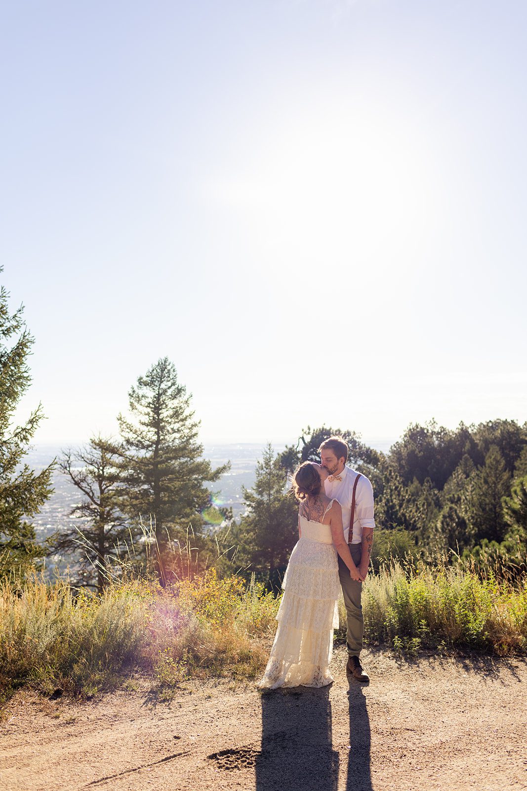 bride and groom kiss at artist point after their intimate elopement ceremony