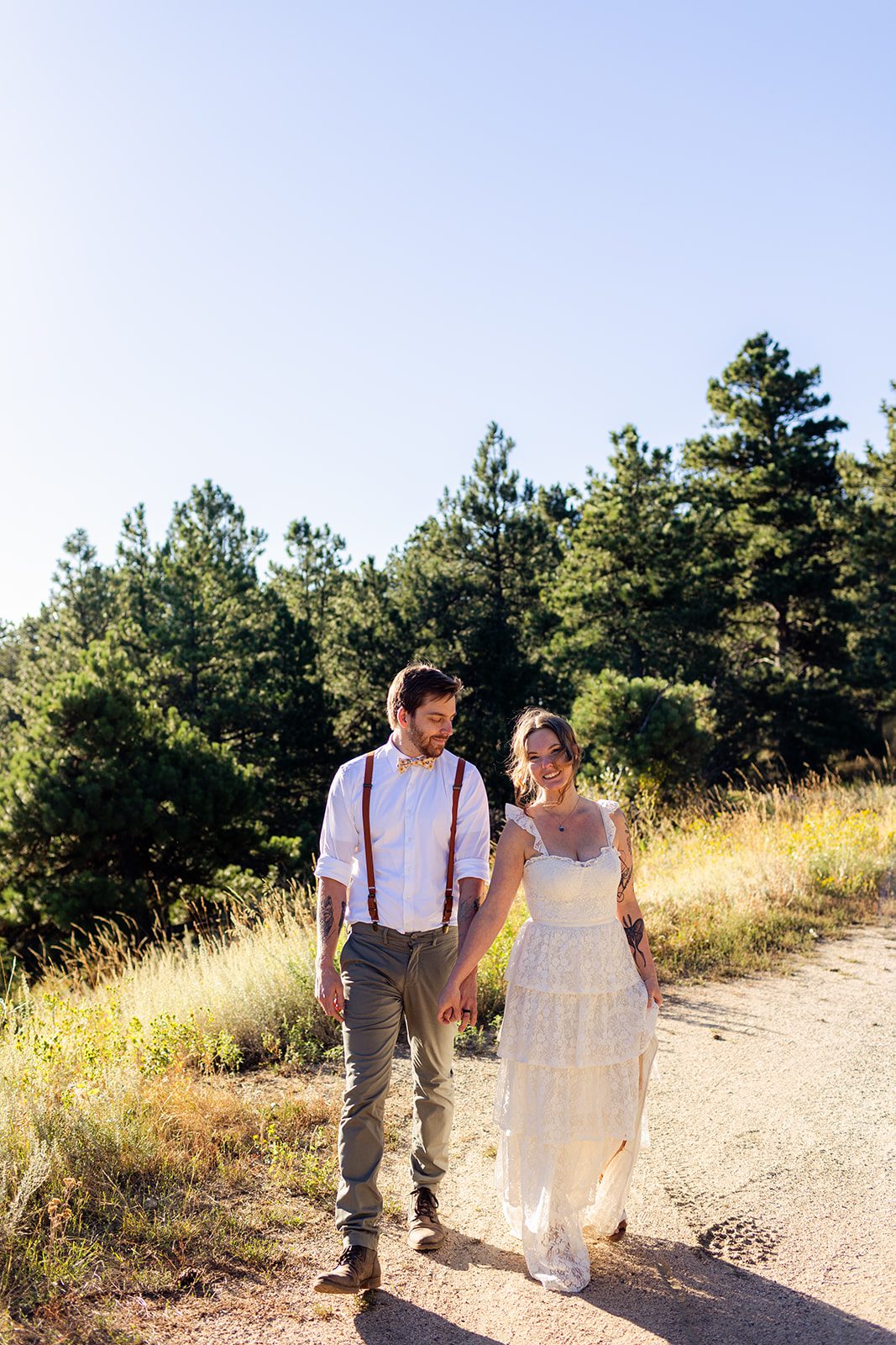 bride and groom walking after elopement at artist point