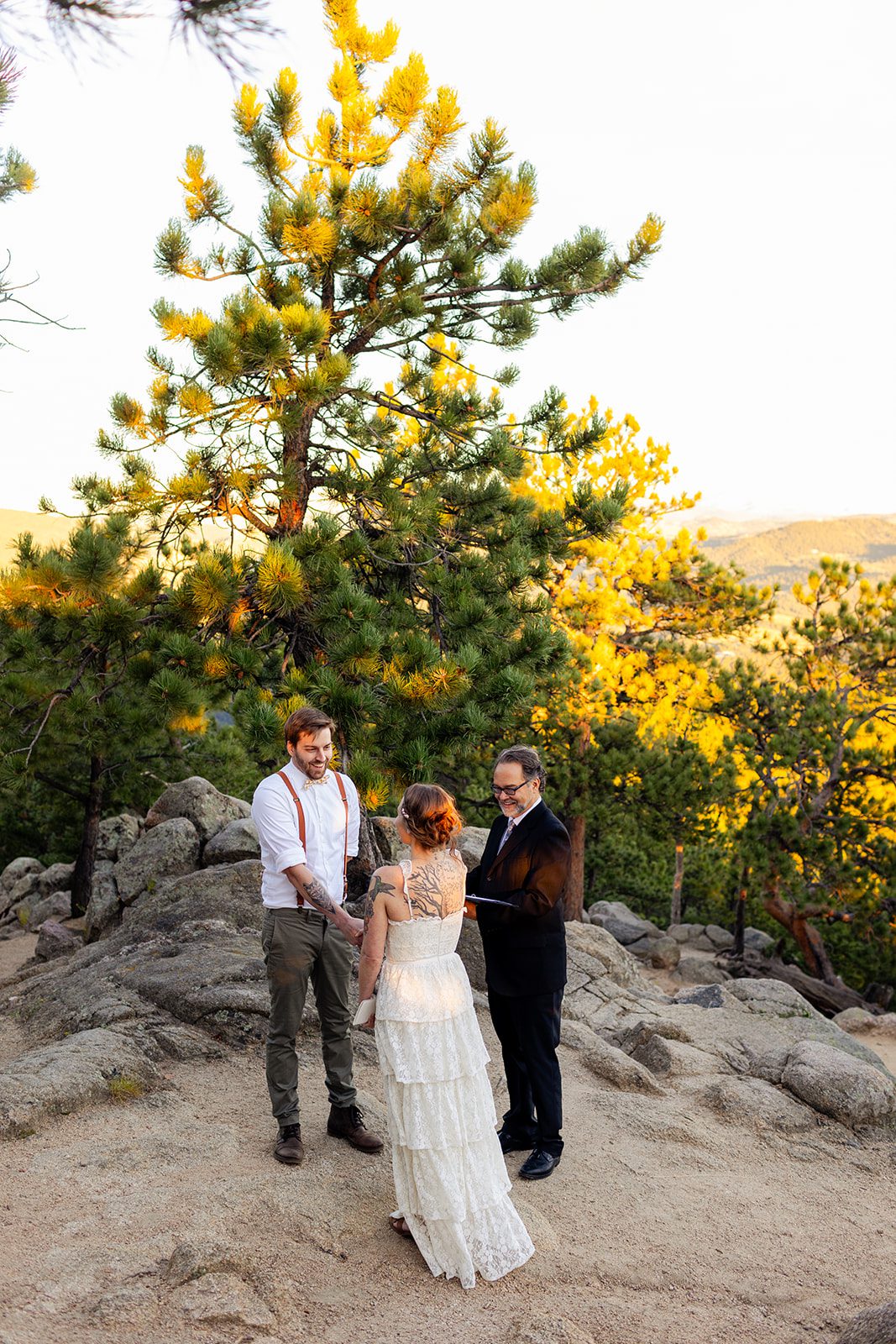 Sunrise elopement at Artist Point with bride and groom and officiant