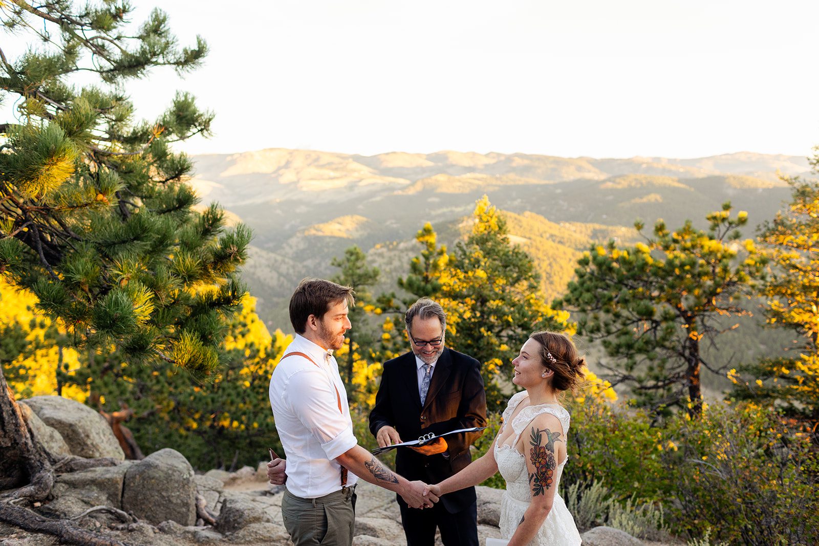 bride and groom holding hands during artist point elopement ceremony