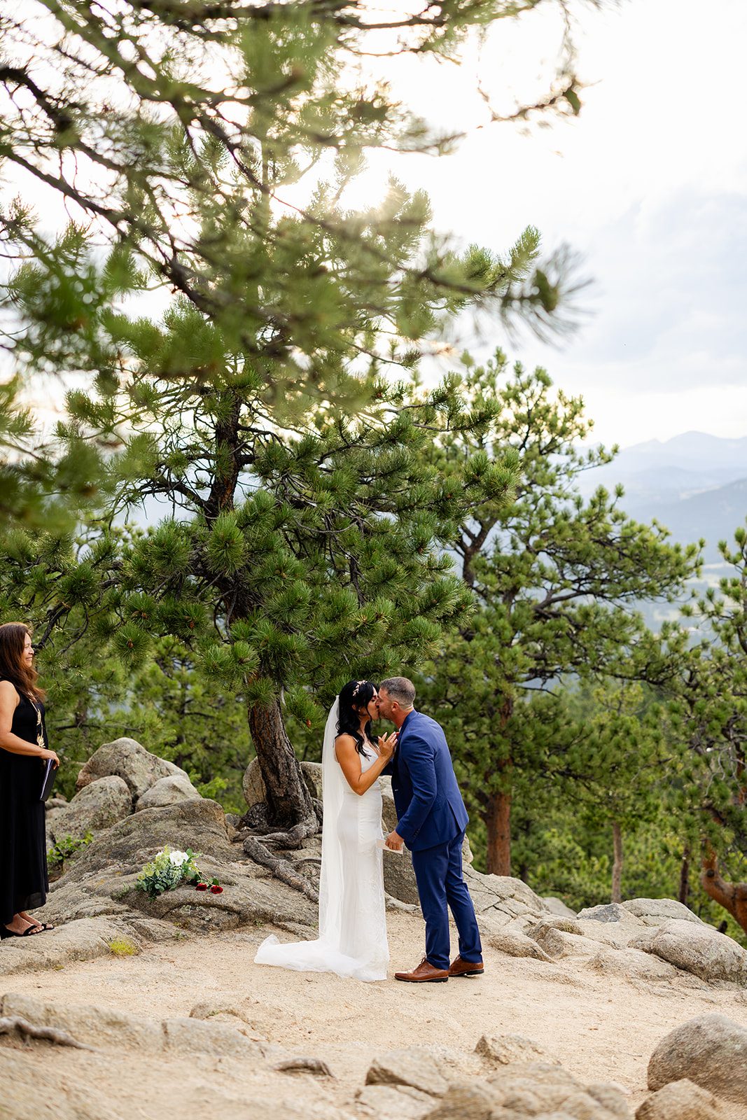 bride and groom kissing after sharing personal vows at artist Point elopement ceremony 