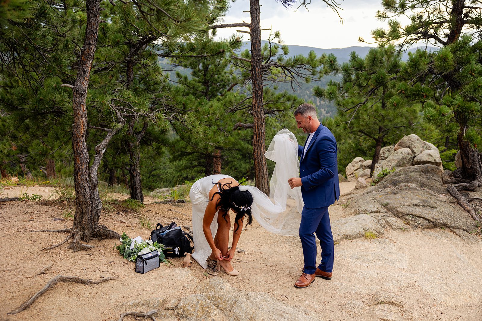 Bride putting on her shoes for Sunset elopement at Artist Point 