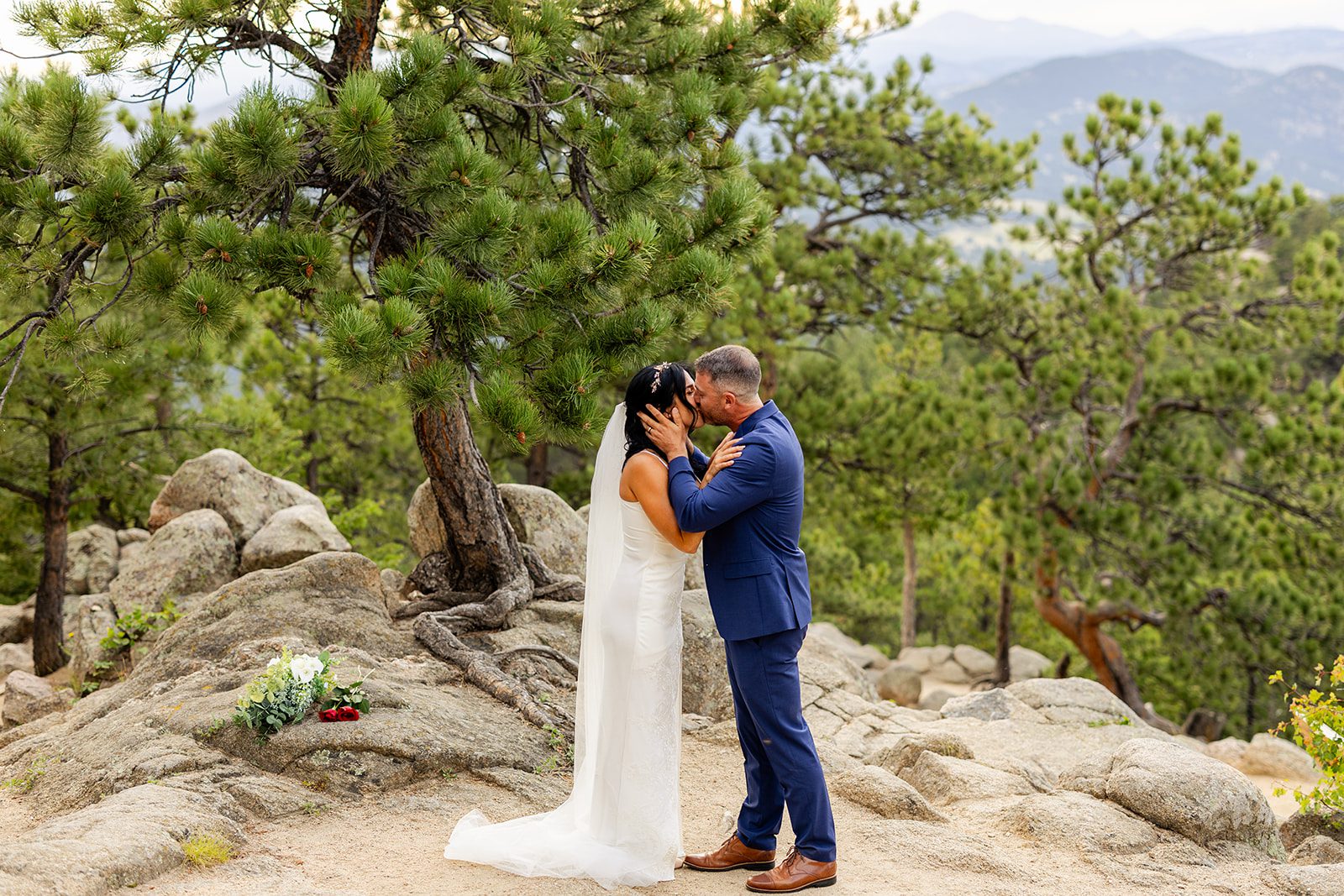 bride and groom kissing at Artist point elopement.