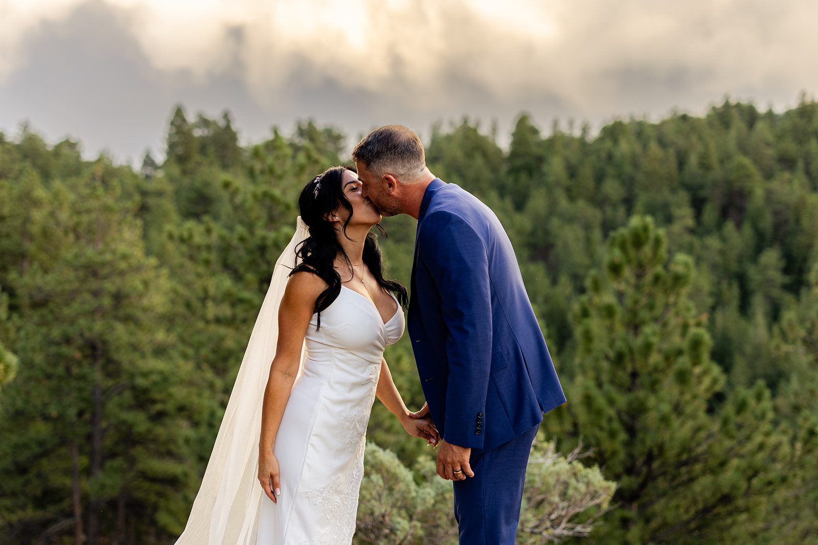 bride and groom kissing at sunset after their Artist Point Elopement. 