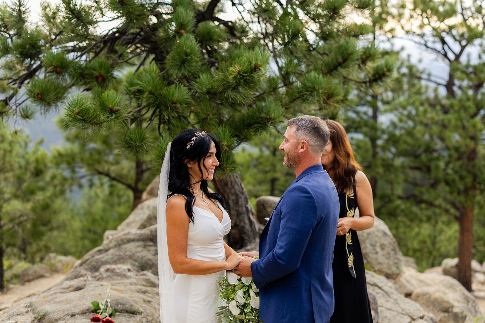 Bride and groom holding hands during elopement ceremony at Artist Point. 