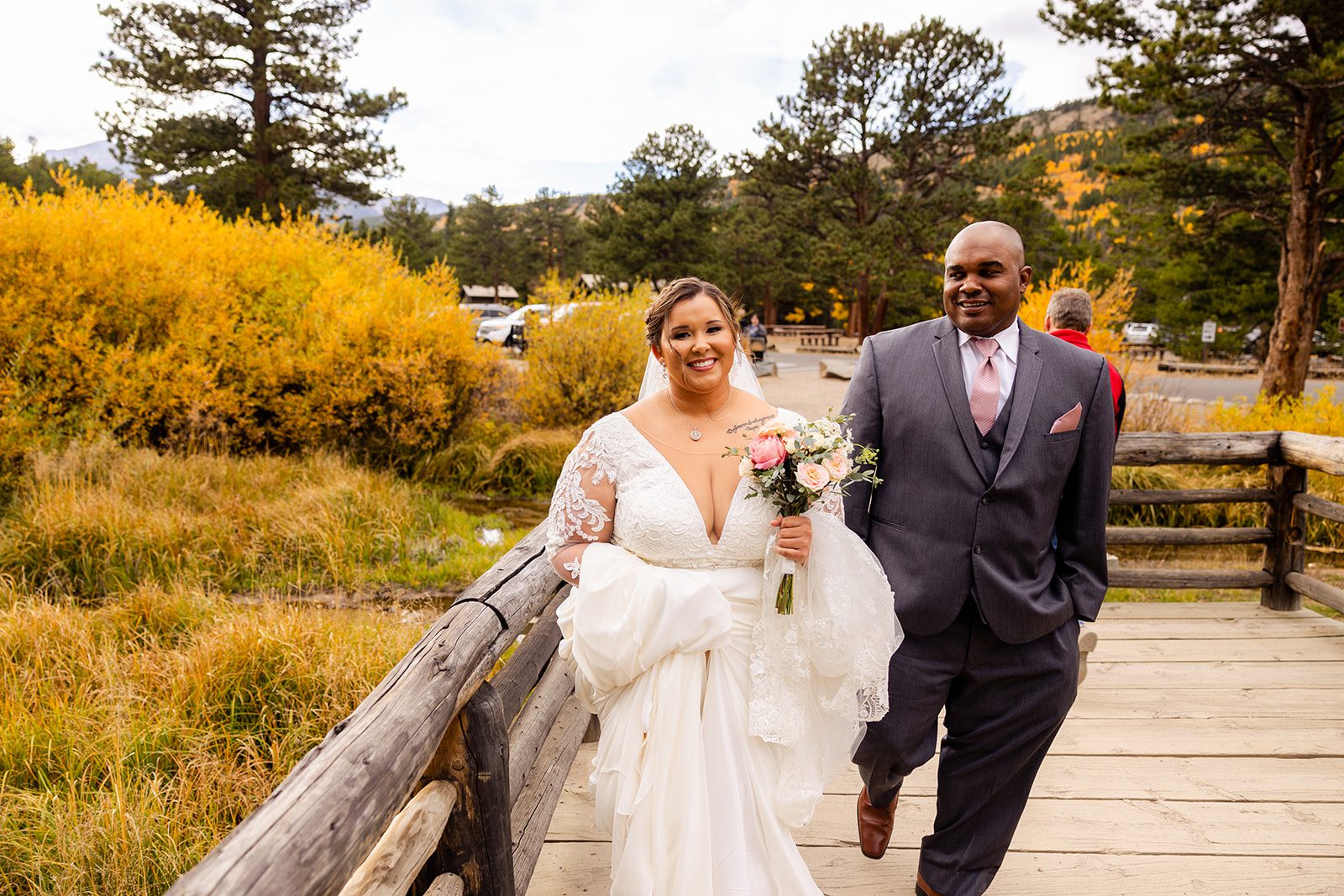 gorgeous bride with her dad, walking towards her elopement ceremony at Sprague Lake. 