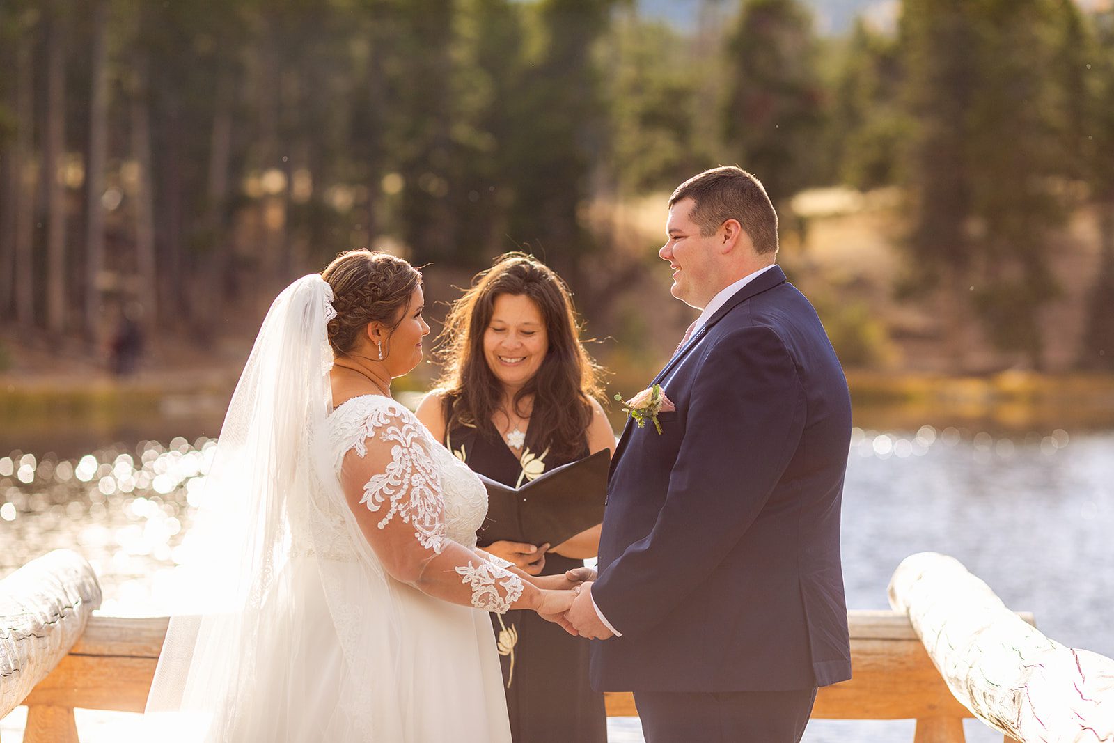 sweet smiles from bride and groom  during Fall elopement ceremony at Sprague Lake. 