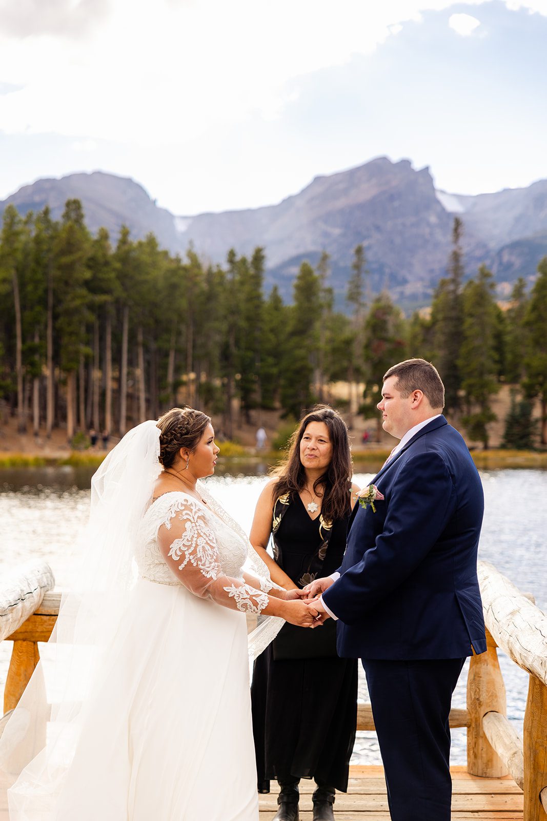 bride an groom during intimate Fall elopement ceremony at Sprague Lake. 