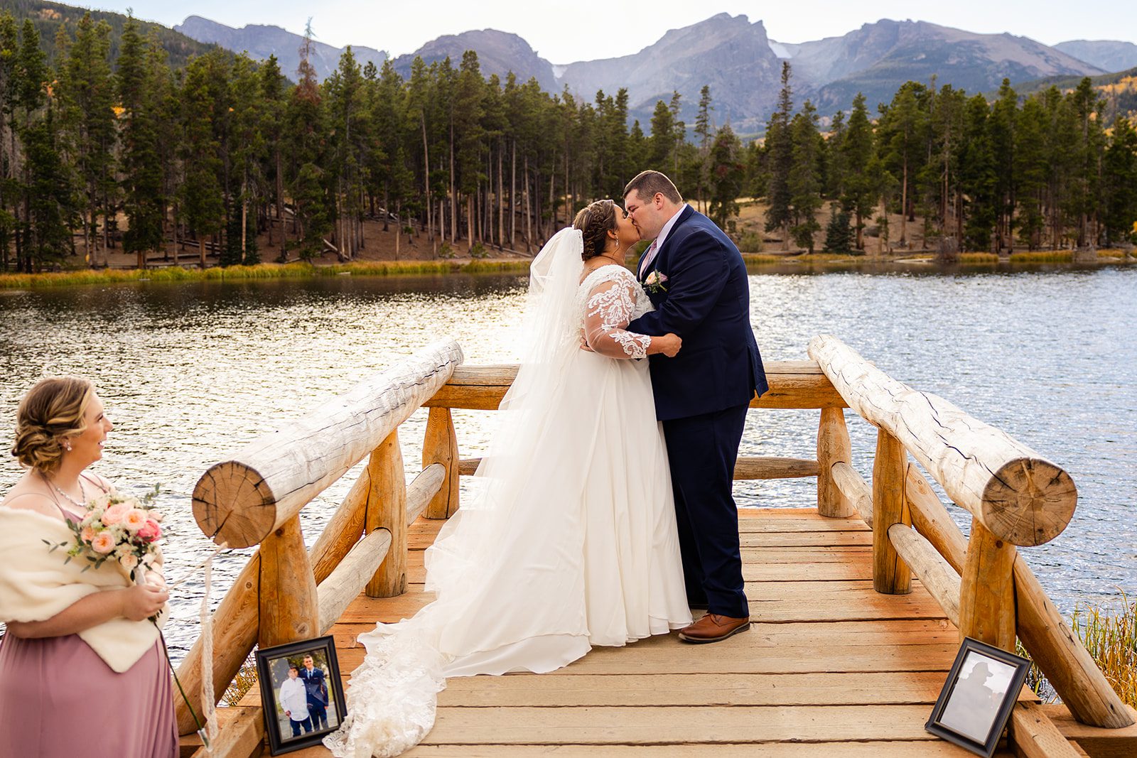 bride and groom kiss for the first time as husband and wife during their Fall elopement at Sprague Lake in rocky mountain national park. 