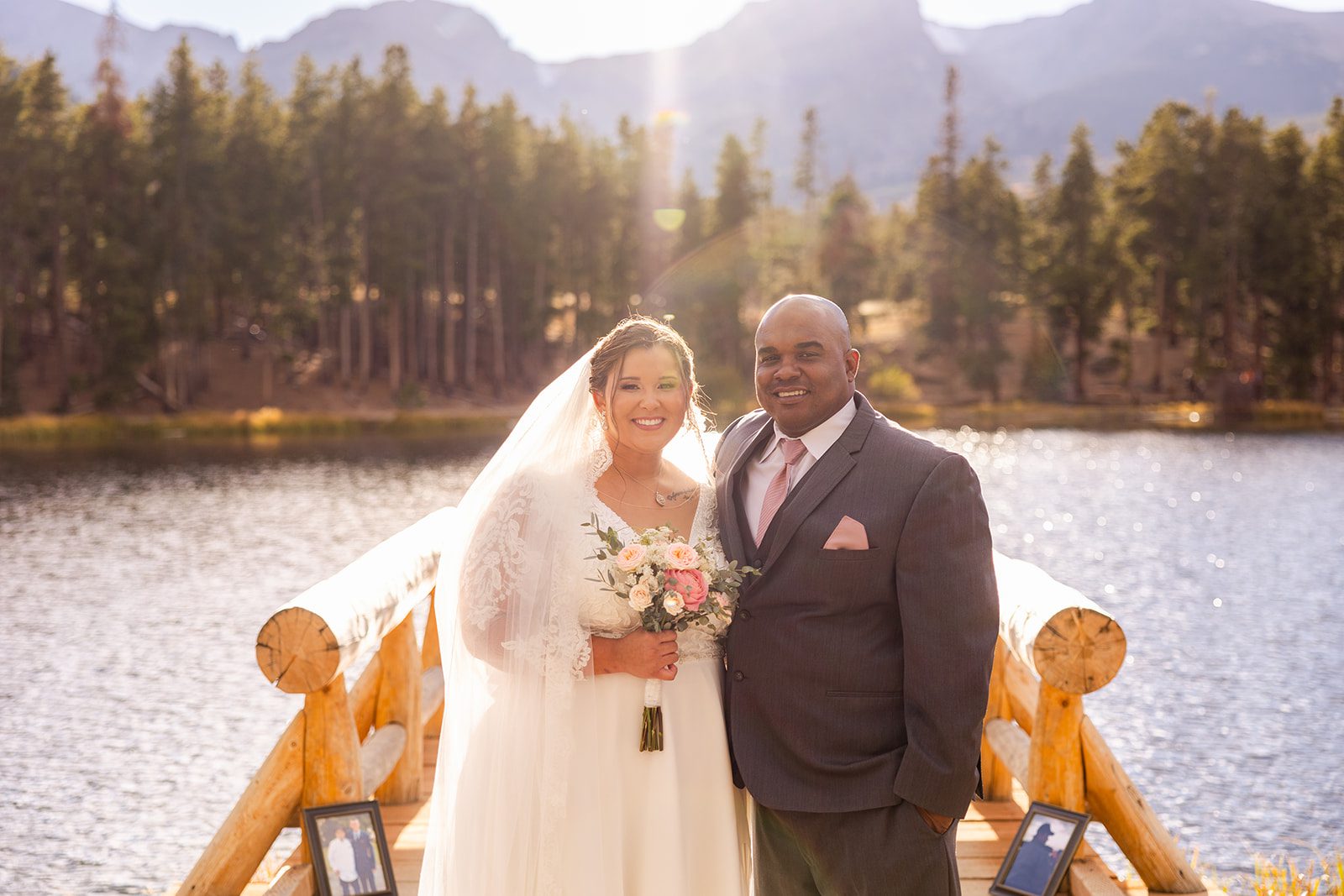 gorgeous bride in a white gown with pink bouquet and her father after her rocky mountain national park elopement. 