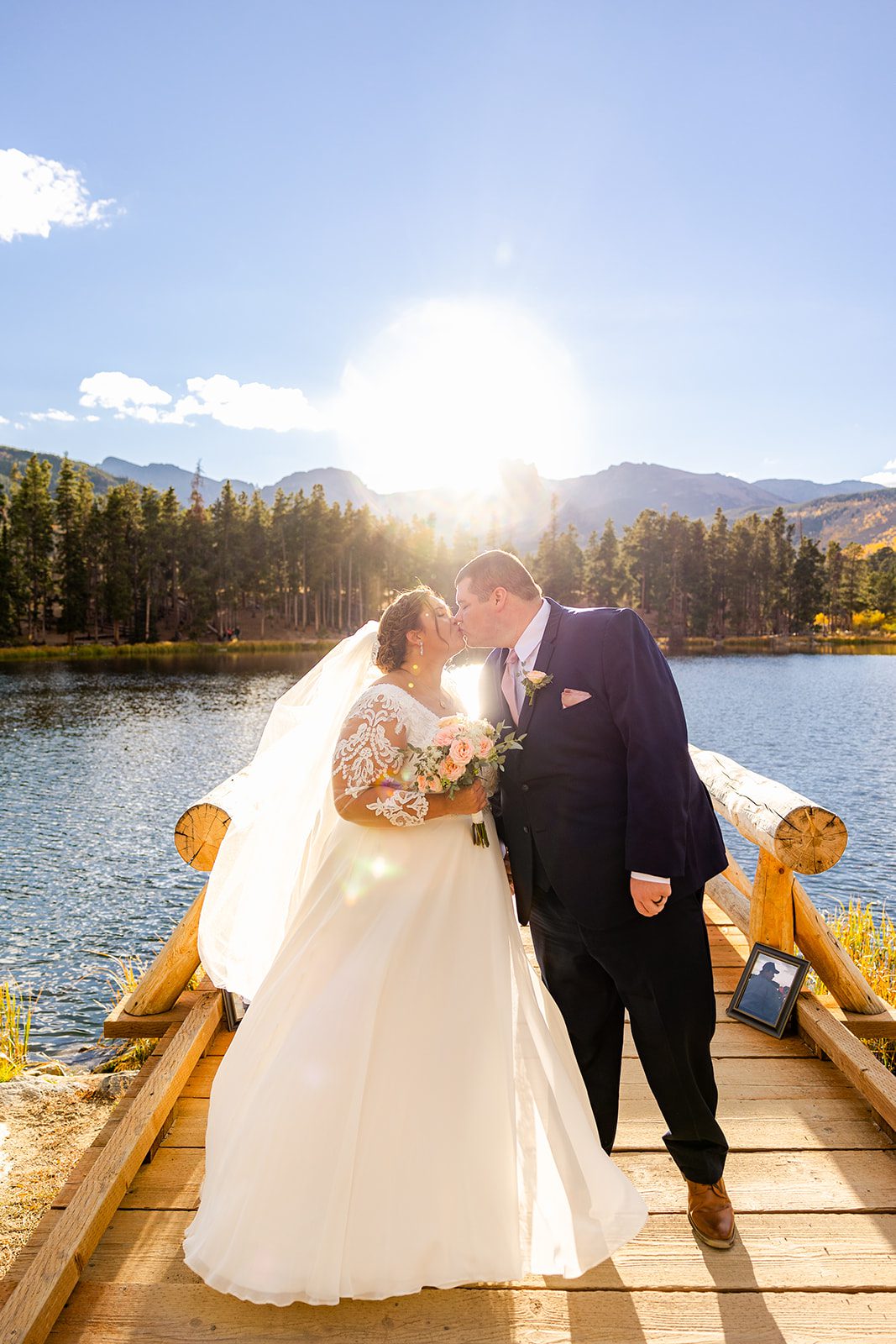sunset portrait of bride and groom after their Fall elopement at Sprague Lake. 