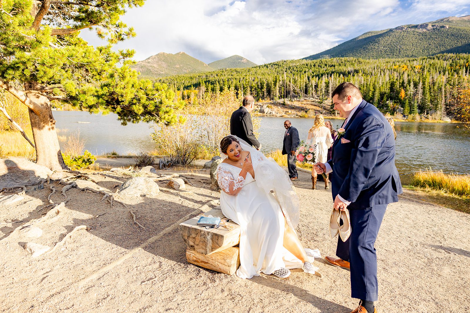 bride and groom being goofy, during Fall elopement at Sprague Lake. 