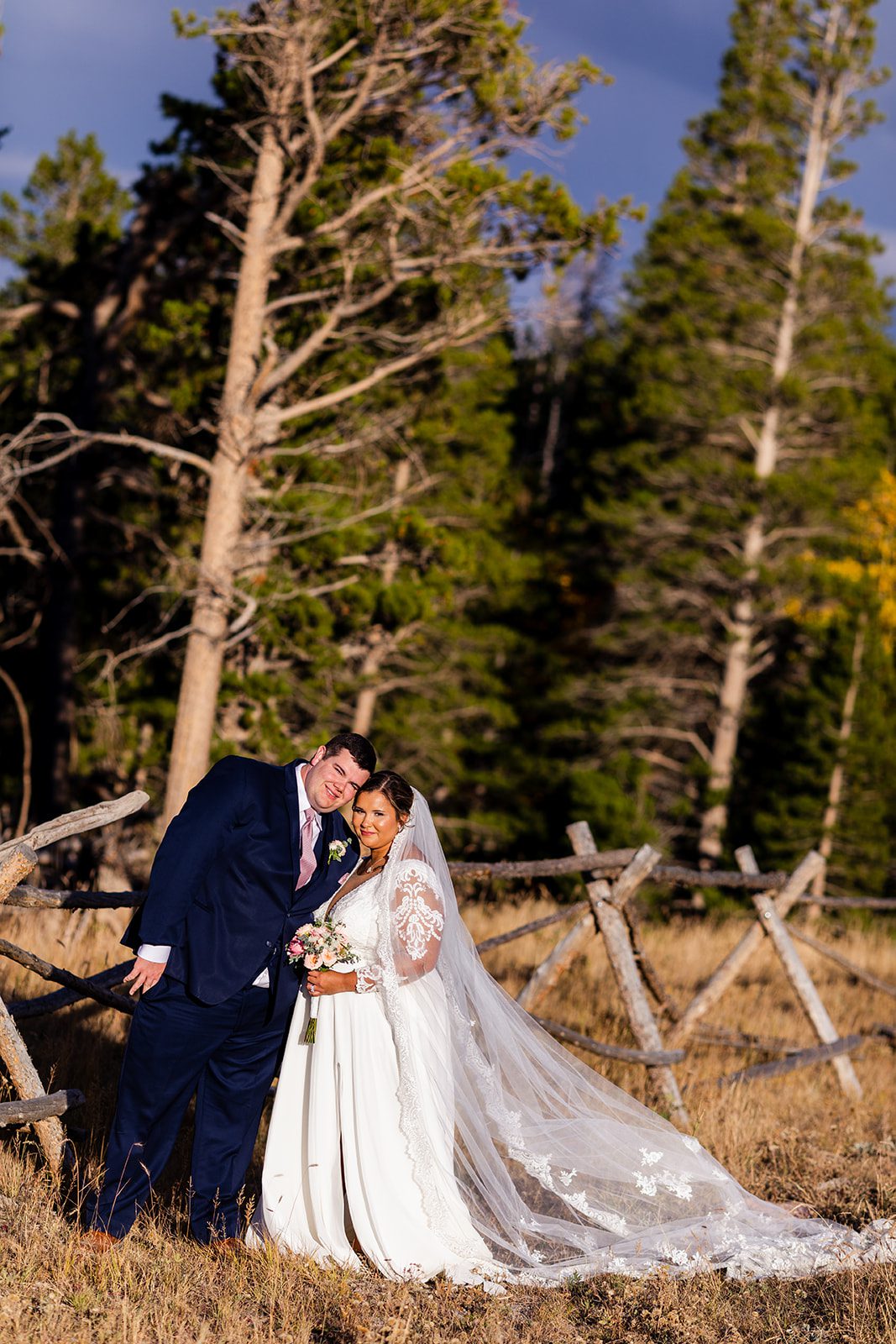 bride and groom in rocky mountain national park after their fall elopement at sprague lake. 