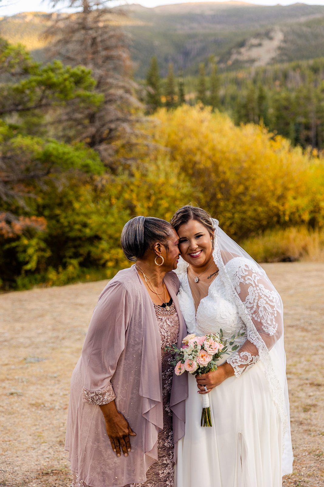 gorgeous bride in white bridal gown during fall elopement at Sprague Lake. 